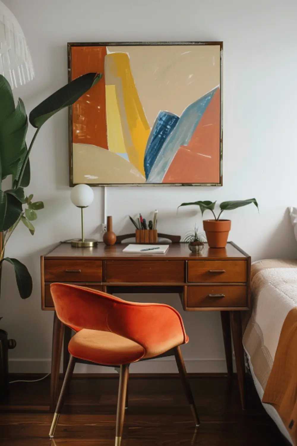 Bedroom with a retro chic workspace and abstract art