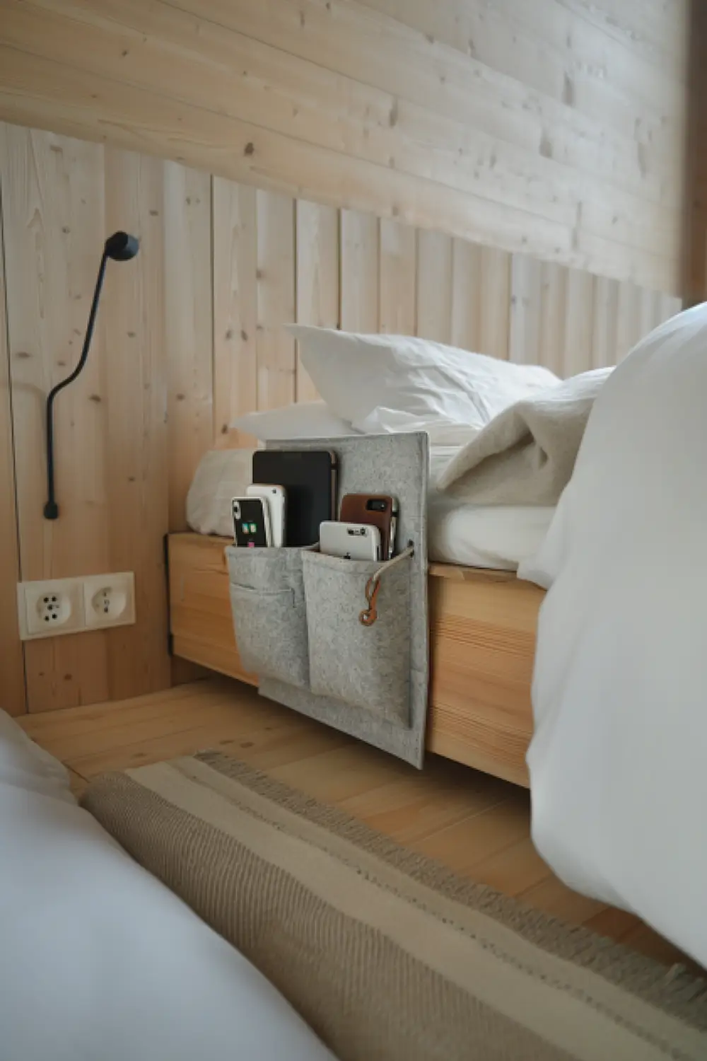 Bedroom with bedside caddy for storage